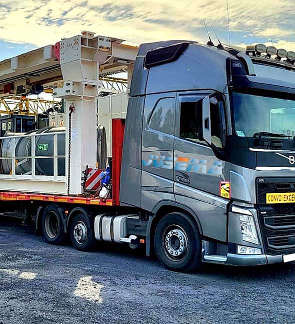 International industrial equipment transport on a lowbed trailer in Europe